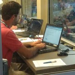 Working hard in the press box at Coca-Cola Park