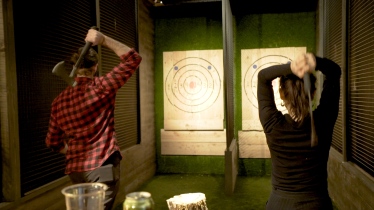 Throwing axes at Kick Axe Throwing in NYC
